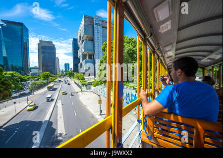 RIO DE JANEIRO - JANUARY 31, 2017: Passengers ride the tram to Santa Teresa, a service gradually being reinstated after an accident in 2011, against a Stock Photo