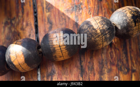 Detail of the rigging on the mainmast of an old sailing ship, showing a row of wooden fittings forming part of the mainsail rigging Stock Photo