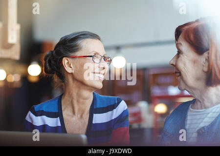 Two aged women having talk at leisure Stock Photo