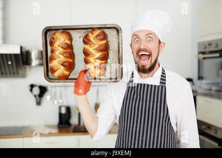 Happy Baker Standing Near Tray With Bread At The Bakery Stock Photo,  Picture and Royalty Free Image. Image 46213780.