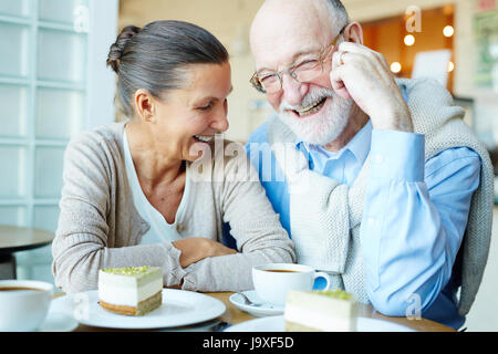 Joyful spouses having fun in cafe at leisure Stock Photo
