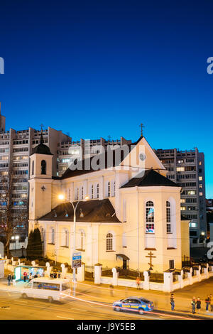 Minsk, Belarus - April 3, 2017: Evening Night View Of Cathedral of the Holy Apostles Sts Peter and Paul On Illuminated Nemiga Street. Temple of the Be Stock Photo