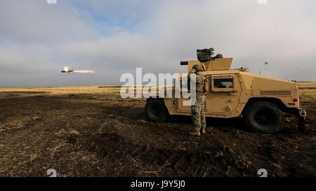 U.S. Marine soldiers fire a HMMWV-mounted BGM-71 tube-launched, optically-tracked, wire-guided anti-tank missile during exercise Platinum Lynx at the Smardan Training Area December 9, 2015 in Smardan, Romania.    (photo by Melanye E. Martinez /US Marines  via Planetpix) Stock Photo