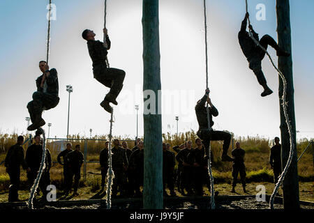 U.S. Marine soldiers climb ropes during a physical fitness obstacle course at the Rota Naval Base February 26, 2015 in Rota, Spain.    (photo by Christopher Mendoza /US Marines  via Planetpix) Stock Photo