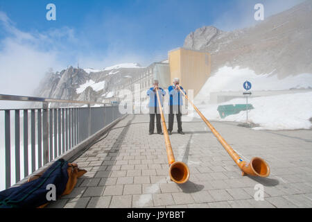 LUCERN, SWITZERLAND - APRIL 10 : Unidentified musicians are playing music with Alpine horns at Pilatus Mountain in Lucern Switzerland on April 10, 2010. Stock Photo