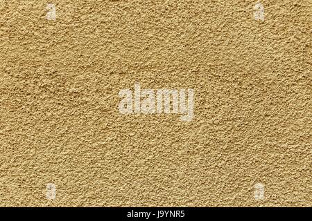 Texture yellow plastered wall for background. Yellow textured painted wall Stock Photo