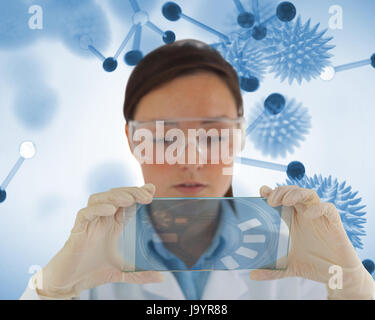 Careful nurse holding a virtual screen in front of camera Stock Photo