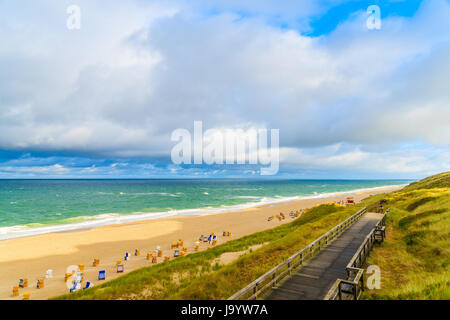 Coastal walkway along Wenningstedt beach at sunrise, Sylt island, North Sea, Germany Stock Photo