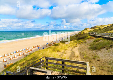 Coastal walkway along Wenningstedt beach in early morning light on Sylt island, North Sea, Germany Stock Photo