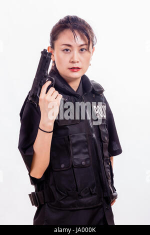 Chinese female police officer pointing handgun Stock Photo - Alamy