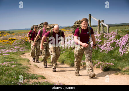 UK, Wales, Pembrokeshire, Solva, Nine Wells, Parachute Regiment soldiers training with full packs on Coast Path Stock Photo
