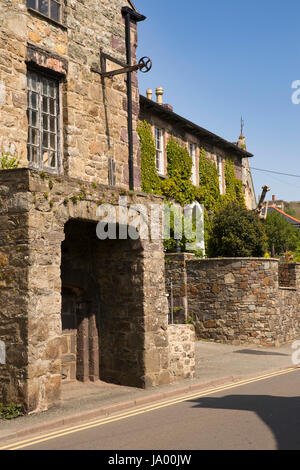 UK, Wales, Pembrokeshire, Solva, Main Street, old industrial hoist outside stone building Stock Photo