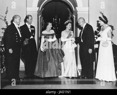 President and Mrs. Dwight D Eisenhower greet Queen Elizabeth and Prince Philip of Great Britain at the White House, along with Lord and Lady Caccia (standing, extreme left and right), the British Ambassador to the US and his wife, Washington, DC, 1957. Stock Photo