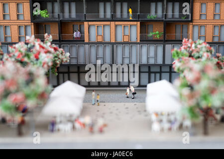 Miniature model, miniature toy buildings, cars and people. City maquette. Stock Photo