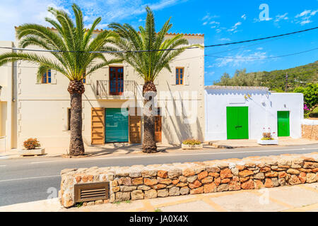 Street with typical architecture of Sant Carles de Peralta village with colourful houses, Ibiza island, Spain Stock Photo