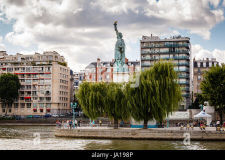 PARIS - JUNE 30: Statue of Liberty on June 30, 2013 in Paris, France. This statue is a miniature of her bigger sister in New York Harbour. Stock Photo
