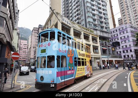 Hong Kong, China. 29th Mar, 2017. A tram runs on the road in Wan Chai of Hong Kong, south China, March 29, 2017. July 1, 2017 marks the 20th anniversary of Hong Kong's return to the motherland. Credit: Wang Xi/Xinhua/Alamy Live News Stock Photo