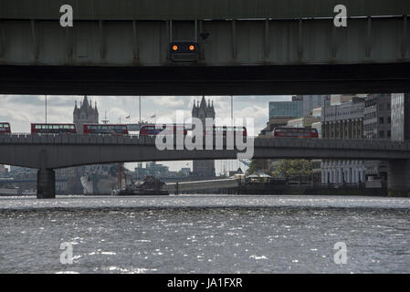 Aftermath of London Bridge and Borough Market terrorist attack, Buses stand idle, London, UK. Picture taken from rib in the river between 8 and 9 am, 04th June, 2017. View of London Bridge from Thames river.  Credit: Tony Pincham/Alamy Live News Stock Photo