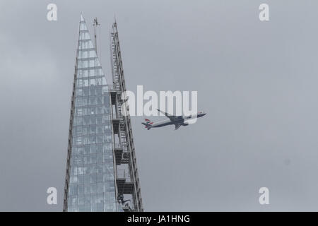 London UK.  4th June 2017. A British Airways passenger jet flies over the Shard a day after the London Bridge and Borough Market terror attacks Stock Photo