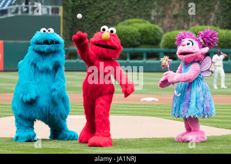 Philadelphia, Pennsylvania, USA. 4th June, 2017. Sesame Street's Elmo throws out the first pitch with Cookie Monster and Abby Cadabby watching during the MLB game between the San Francisco Giants and Philadelphia Phillies at Citizens Bank Park in Philadelphia, Pennsylvania. Christopher Szagola/CSM/Alamy Live News Stock Photo