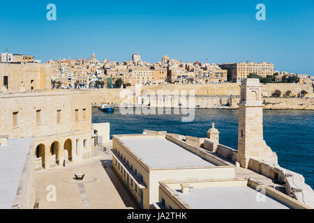 Valletta city walls as seen from Birgu (Vittoriosa) with bastioned Fort Saint Angelo in the foreground, Malta Stock Photo