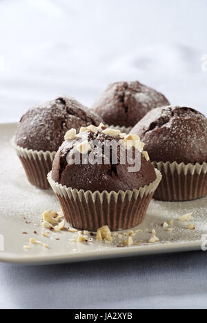 Delicious double chocolate muffins on a plate Stock Photo