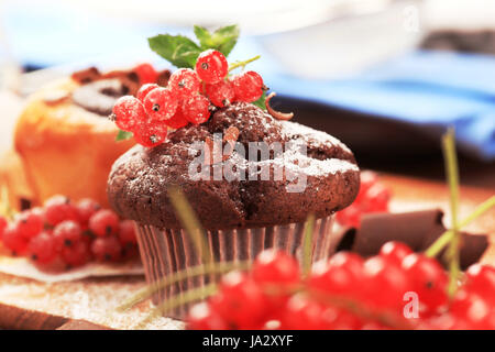 Tasty muffins garnished with red currants Stock Photo