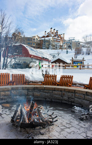 A fire around which skiers can keep warm and take a break at Beaver Creek, a ski resort near Avon, Colorado. Stock Photo