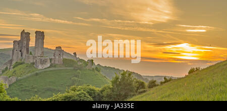 Corfe Castle,Dorset,England on a golden Sunset Stock Photo