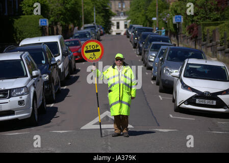 lollipop man road west end Glasgow school crossing Stock Photo