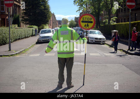 lollipop man road west end Glasgow school crossing Stock Photo