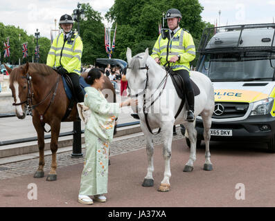 Japanese guest to a Royal Garden party in the grounds of Buckingham Palace London UK Stock Photo