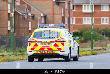 Sussex police car patrolling on a road in the UK. Stock Photo