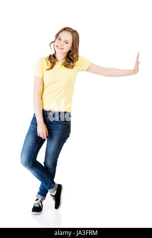 Casual standind young woman portrait. Stock Photo