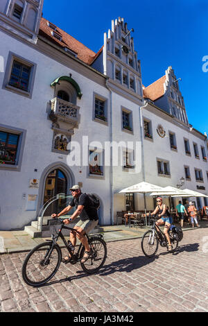 People ride a bike on Meissen Markt in front of City Hall Meissen Old Town Saxony, Germany cycling Europe Riding bike Stock Photo