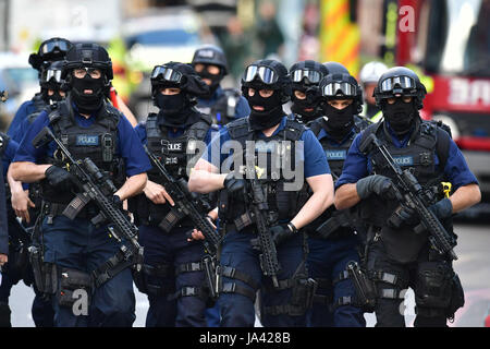 Armed police on St Thomas Street, London, near the scene of last night's terrorist incident at Borough Market. Stock Photo