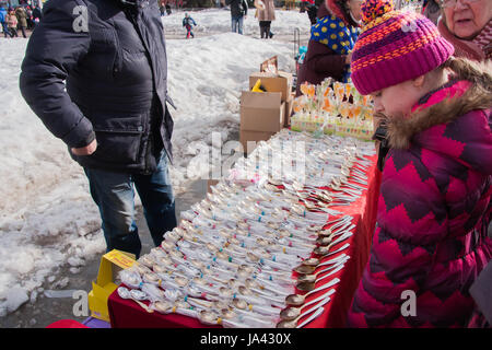 PERM, RUSSIA - March 13, 2016: Trade stalls with silver spoons in celebration of Maslenitsa Stock Photo