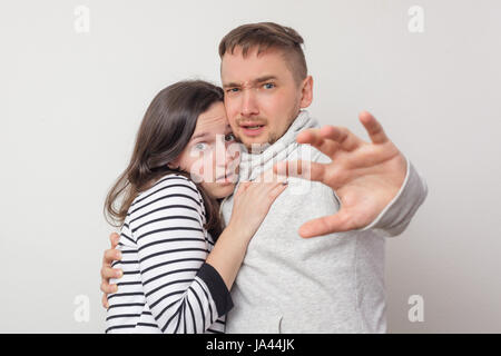 Emotional facial expression of couple, woman and man looking surprised with open mouth Stock Photo