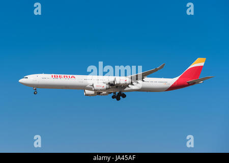 Madrid, Spain - May 22, 2017: Iberia Airbus 340-600 is landing in Madrid Barajas airport on May 22, 2017. Iberia is the  flag carrier and the largest  Stock Photo