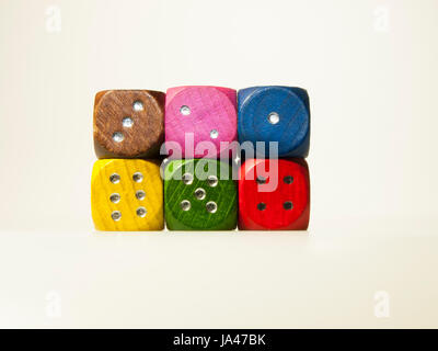 Isolated wooden game dices with numbers in six colors Stock Photo