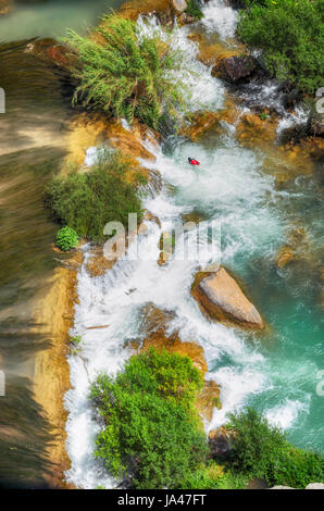 Top view of waterfalls. Mijares river, in the province of Castellon (Valencian Country - Spain). Beautiful color of his clear waters. Intense tones. Stock Photo