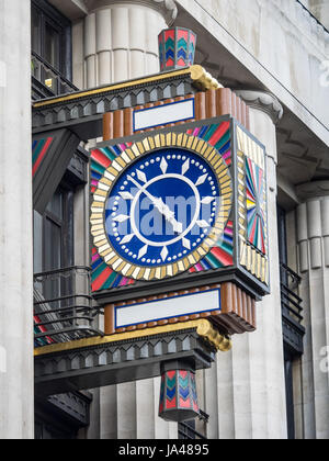 Ornate Art Deco Clock on the former Daily Telegraph Building in Fleet Street, London. The Building (now Peterborough Court) houses Goldman Sachs Stock Photo