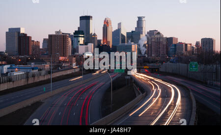 MINNEAPOLIS, MINNESOTA/UNITED STATES – March 27: The highway carries rush hour commuters in and out of downtown at sunset on 03/27/2015 in Minneapolis Stock Photo