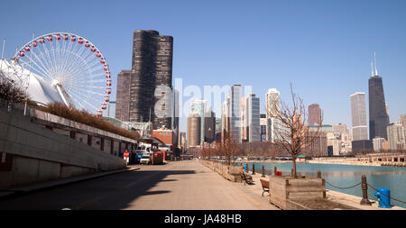 CHICAGO, ILLINOIS/UNITED STATES – April 1: Navy Pier with it's carnival ride and view of the downtown city skyline 04/01/2015 in Chicago, Illinois. Stock Photo