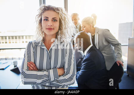 Business woman standing in front of team, Team of mixed entrepreneurs Stock Photo