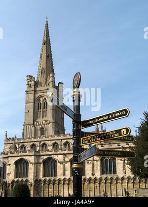 All Saints Church Stamford with finger post direction sign in foreground, Red Lion Square, Stamford, Lincolnshire, England, UK. Stock Photo
