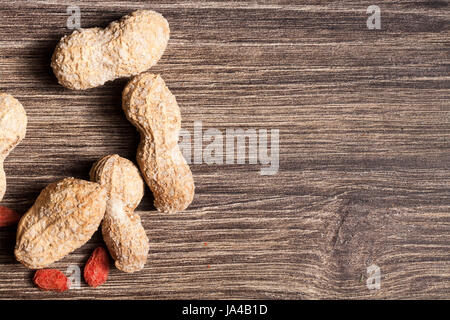 Mix Of Different Type Of Nuts On Wooden Background In Studio Photo 