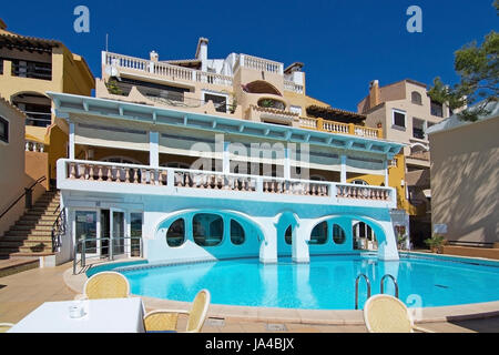 CALA FORNELLS, MALLORCA, SPAIN - SEPTEMBER 6, 2016: Tortuga restaurant art nouveau modernisme style windows and pool on a sunny day on September 6, 20 Stock Photo