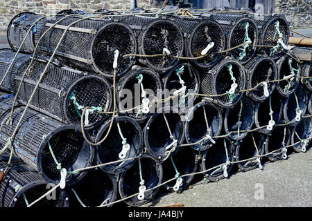 Lobster pots piled up on Conwy Harbour Conwy, North Wales, UK. Stock Photo