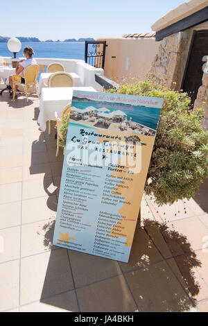 CALA FORNELLS, MALLORCA, SPAIN - SEPTEMBER 6, 2016: Tortuga restaurant menu information board and sea view on a sunny day on September 6, 2016 in Cala Stock Photo